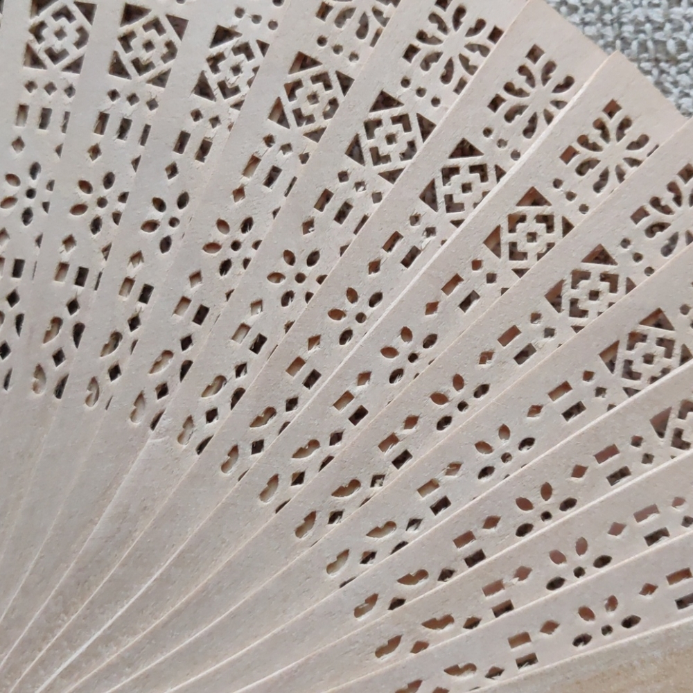 Pierced wooden oriental Hand fan